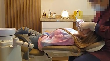 Young Woman Worked On By Mature Dentist Wearing Skin Tight Latex Gloves